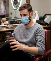 Man Typing In His Phone
